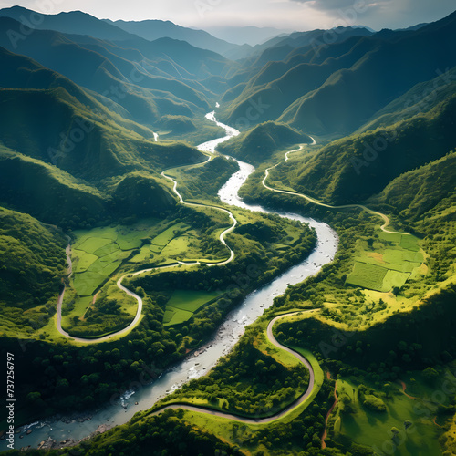 An aerial view of a winding river through a lush valley