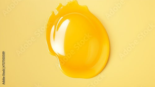 Artificial egg yolk isolated on yellow background