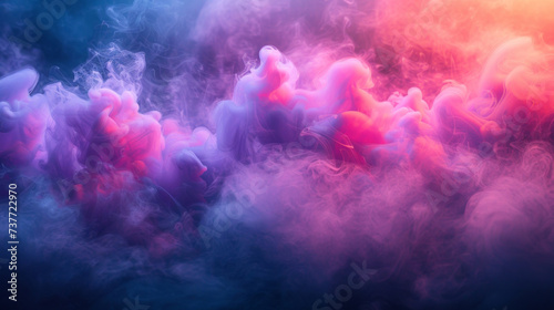 Closeup of colorful smoke in motion with vibrant hues of pink purple and blue blending together in a magical and hazy mist.