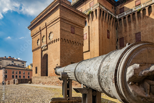 Ferrara, Emilia Romagna, Italy. The culverin called the Queen, a large and ancient cannon pointed towards the entrance of the Estense castle, built by the noble Este family.