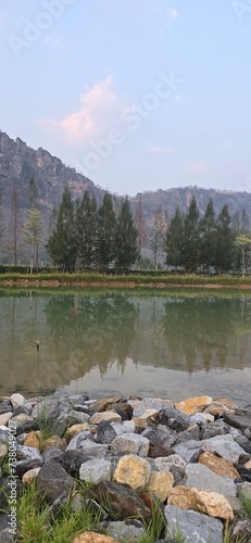 lake in green forest with the mountain
