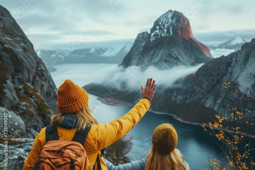 Two friends gazing at a picturesque Norwegian fjord, showcasing the human connection with nature
