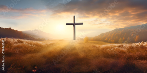 Cross at sunset in a field christian worship concept 