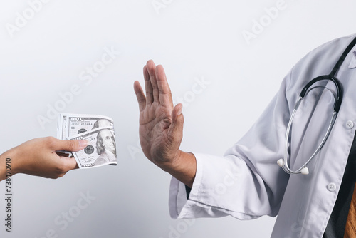 Doctor's hands refusing money from bribing. Bribery and anti corruption concept