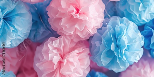Colorful tissue pom poms in pink and blue. Perfect for adding a fun and festive touch to any celebration or event