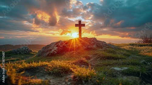 Sunset Behind Cross on Hilltop with Radiant Sunbeams