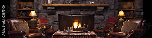 Two brown leather chairs in front of a stone fireplace with burning logs and mantel
