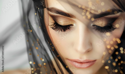 glamorous bridal makeup with golden eyeshadow and sheer veil