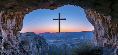 View from the cave at dawn of the Catholic cross with copy space.