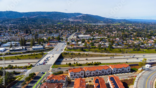 Aerial view of intersection of Highway 85 and Stevens Creek boulevard in Cupertino, California. Residential building construction site, industrial buildings and single family housing.