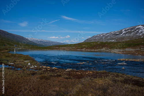 The snow capped Breiddalen Valley at Jotunheimen National Park in Norway,