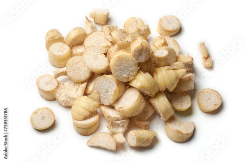 pile of dried organic arrowroot rhizomes pieces to process into powder, maranta arundinacea, tropical plant known for starchy rhizomes harvested various culinary purposes, isolated on white background