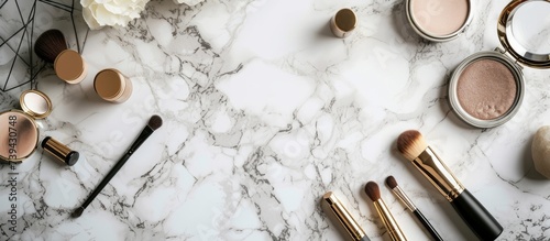 Elegant marble table with assortment of makeup brushes and blushes for beauty routine