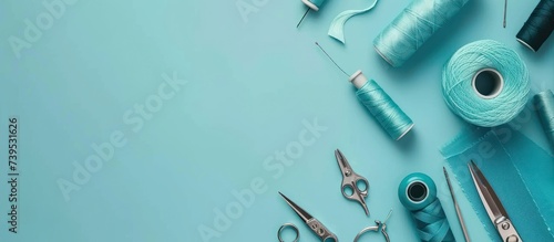 threads and sewing accessories on color background