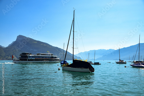 SWITZERLAND-JULY 25: A ferry on Lake Brienz at Interlaken. Boats on Lake Thun. Bernese Oberland. Switzerland. The lake's unusual turquoise color is caused by sediment in glacial melting