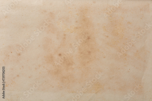 abstract of old discolored book page background, historical and vintage faded with spots or stain creamy or yellowed hue or torn, warmth and depth wallpaper or backdrop for graphic design, blank space
