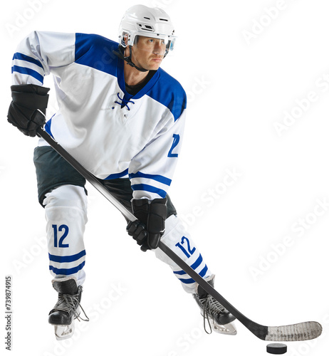 Concentrated young man, hockey player in uniform standing with stick on nice rink against transparent background. Concept of professional sport, competition, game, tournament, match, action