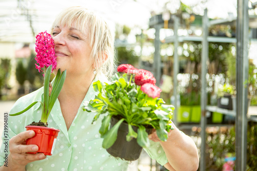 Joyful Gardener Enjoying Fragrant Pink Flowers