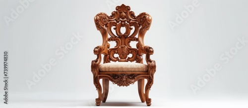 A timeless masterpiece for classical carved wooden chair lovers, this elegant chair features intricate carvings and a comfortable beige cushion.