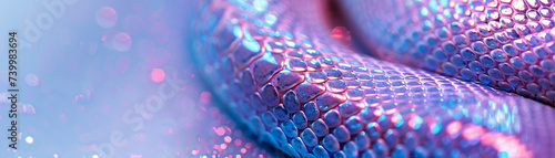 Close up of an anacondas skin in neon light showcasing the texture against a soft pastel background