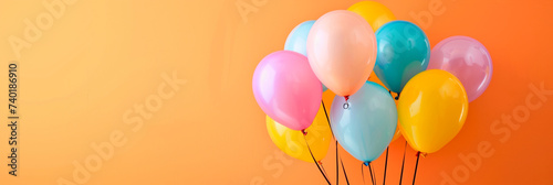 Bunch of bright ballons and copyspace for text on colored background