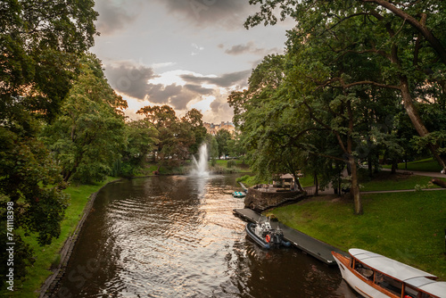 Panorama of the pilsetas kanals (the riga city canal) in the Bastejkalns Park during a sunset afternoon. It's a city park in Riga, Latvia, surrounding the center of the historical city.