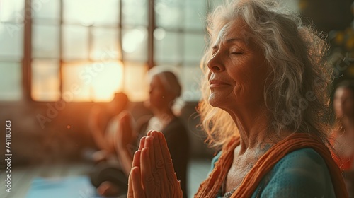 Serene elderly woman leads a yoga session with a focus on mindfulness and wellness in a sunlit room. generative ai