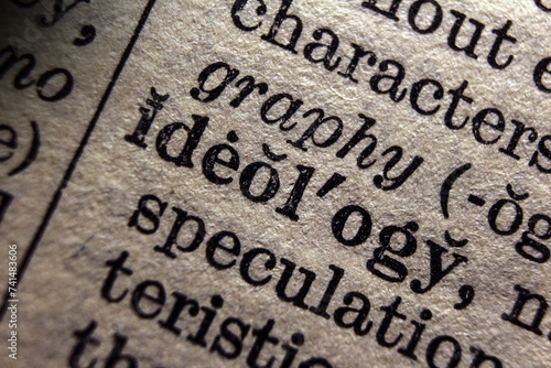 Word object ideology on book page, macro close-up 