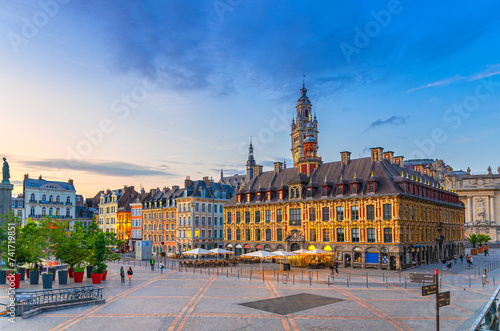 Lille cityscape, La Grand Place square in city center, historical monument Flemish mannerist architecture style buildings, Old Stock Exchange and bell tower Chamber of Commerce, Northern France