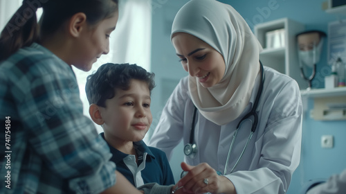 Muslim mother and her children visiting a doctor