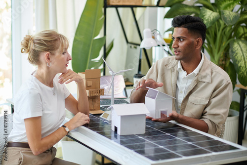 House owner visiting office of company selling solar panels to get consultation