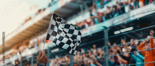 Victory's flag waves against a backdrop of speed and excitement at the finish line