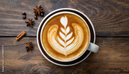 hot coffee cappuccino latte spiral foam top view on dark wooden background