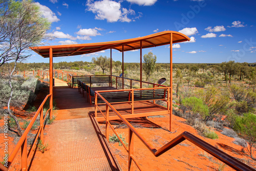 Elevated Kata Tjuta dunes viewing platform near Mount Olga, a large domed rock formation in Northern Territory, Central Australia, surrounded by bushland and steppes