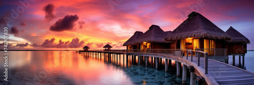 Maldives at a resort on the island at sunset.