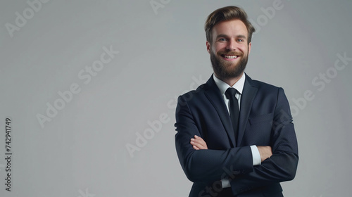 Happy smiling businessman with crossed arms pose, with blank copyspace area for text or slogan, against grey background .