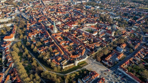 Aerial around the old town of the city Mühlhausen in Thuringia, Germany on a sunny day day in winter 