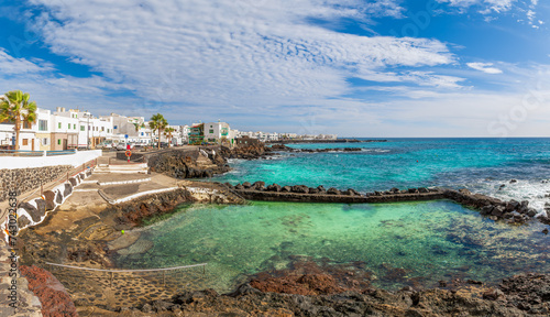 Punta Mujeres, Lanzarote: A charming traditional village with white houses, fishing boats, and stunning ocean views.