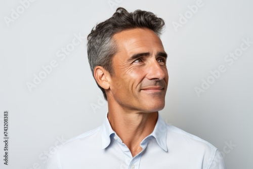 Portrait of a handsome middle-aged man in a white shirt