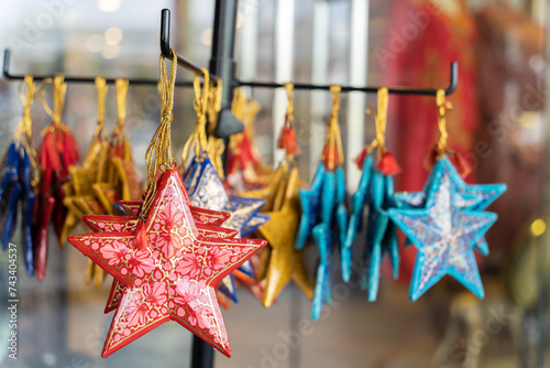 Kashmiri Papier-Mache ornaments stars for sale in the souvenir shop.