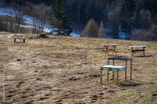 Temporary tables for picnic and bbq in mountains. Wierchomla, Beskid Sadecki in early spring.