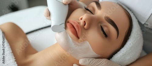 Non-invasive treatment for firming skin, reducing cellulite and fat, using vacuum massage and cosmetology techniques at a beauty salon.