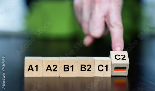 Symbol for learning the German language. Wooden cubes show the skill level A1 to C2.