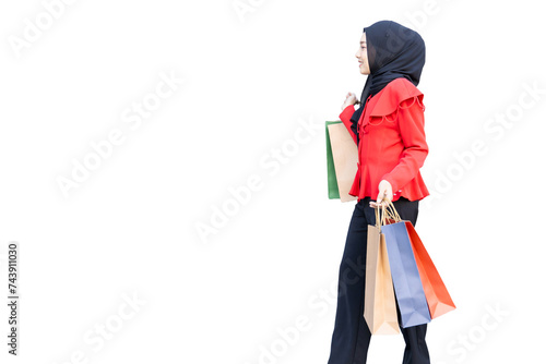 happy muslim arab lady happy enjoy shop in shopping walking street hand holding many paper shopping bag
