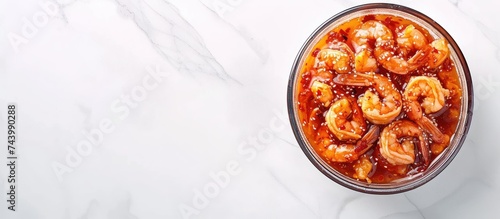 Korean style pickled shrimps Saewoo Jang marinate raw shrimps with chili garlic and soy sauce. with copy space image. Place for adding text or design