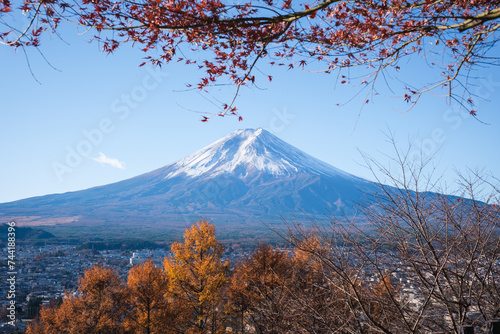 Mont Fuji beautiful view from Fujiyoshida in autumn with colorful maple leaves (momiji), Japan 