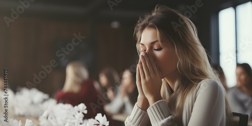 Woman sneezes in office emphasizing hygiene and consideration for coworkers. Concept Health, Sneezing Etiquette, Office Behavior, Hygiene Practices, Consideration for Others