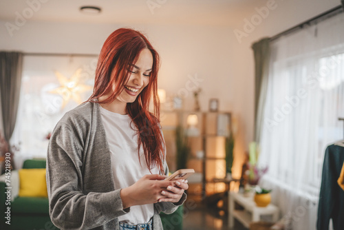 young woman at home use mobile phone sms texting or browse internet