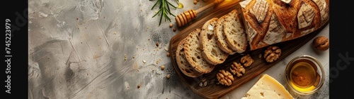 Artisan Bread and Cheese: Artfully arranged artisan bread alongside a selection of cheeses, with accompaniments like nuts and honey, on a wooden cutting board.