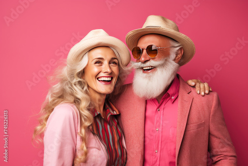 Radiant couple in stylish hats and shades, sharing a joyous moment